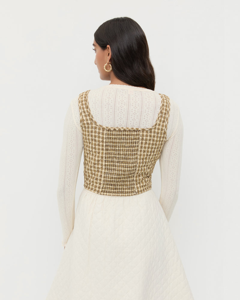 Callista Tie-Front Vest in brown/butter quilted plaid cotton, Lolo Pointelle Long Sleeve Top in cream pointelle cotton, and Clara Quilted Skirt in cream quilted cotton.