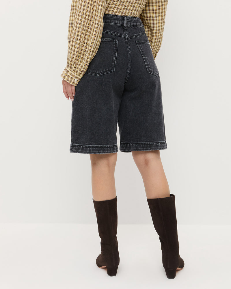 Everett Denim Short in washed black denim, Ken Shirt in brown butter plaid cotton, and Cleo Brown Suede Mid-Calf Boot.