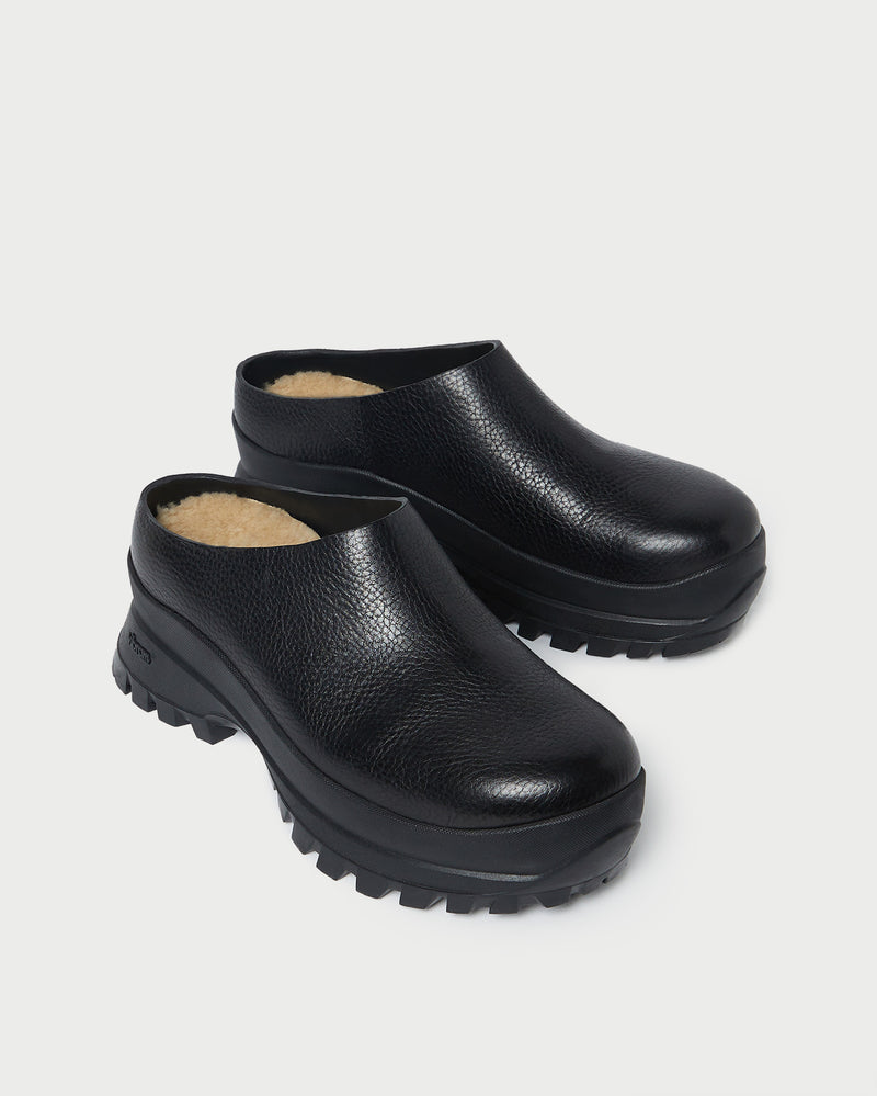 Gemma Black Leather Lug Mule in black pebbled leather.