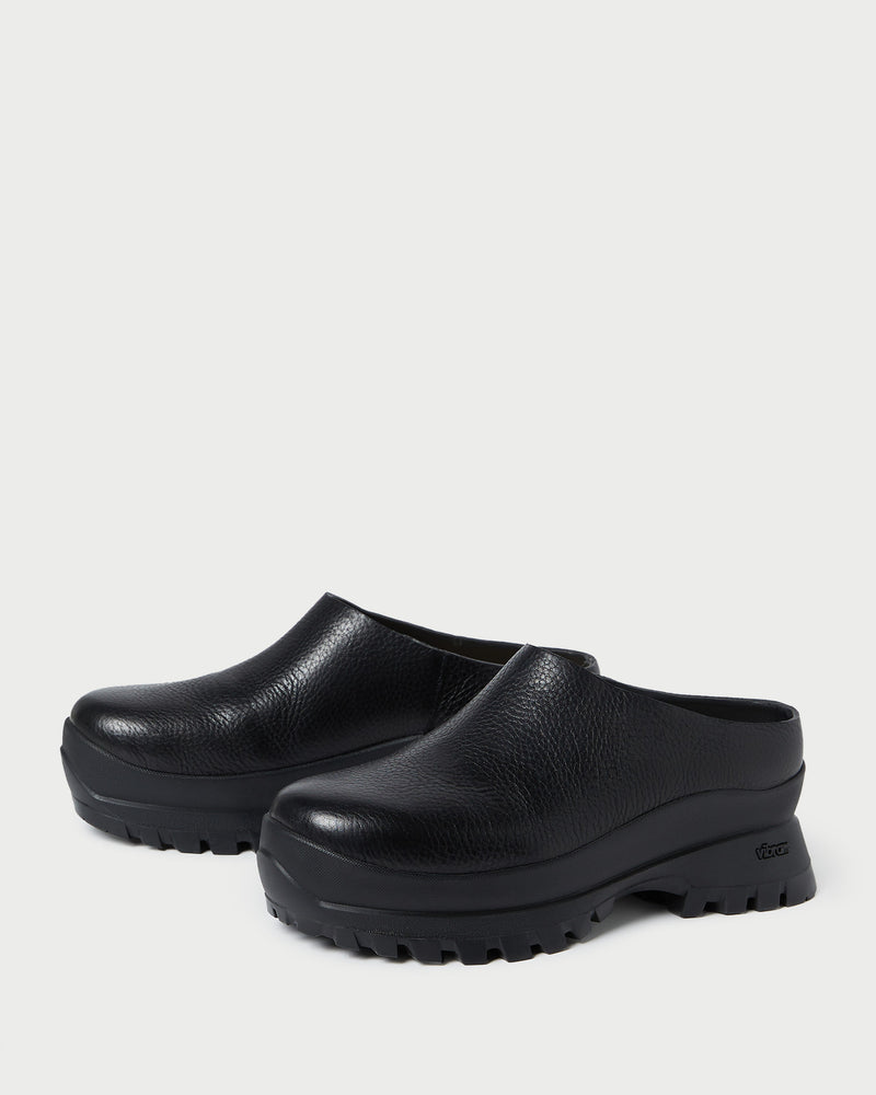 Gemma Black Leather Lug Mule in black pebbled leather.