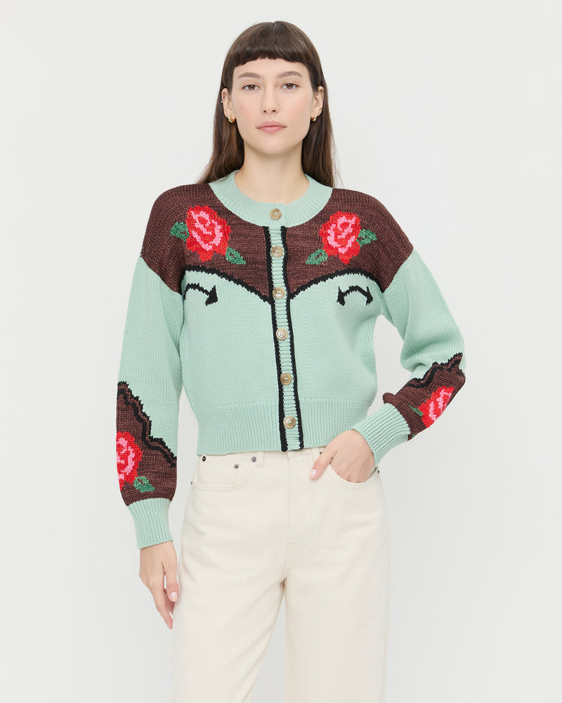 Linda Intarsia Cardigan in green and red wool and Winona Denim Barrel Pant in natural.