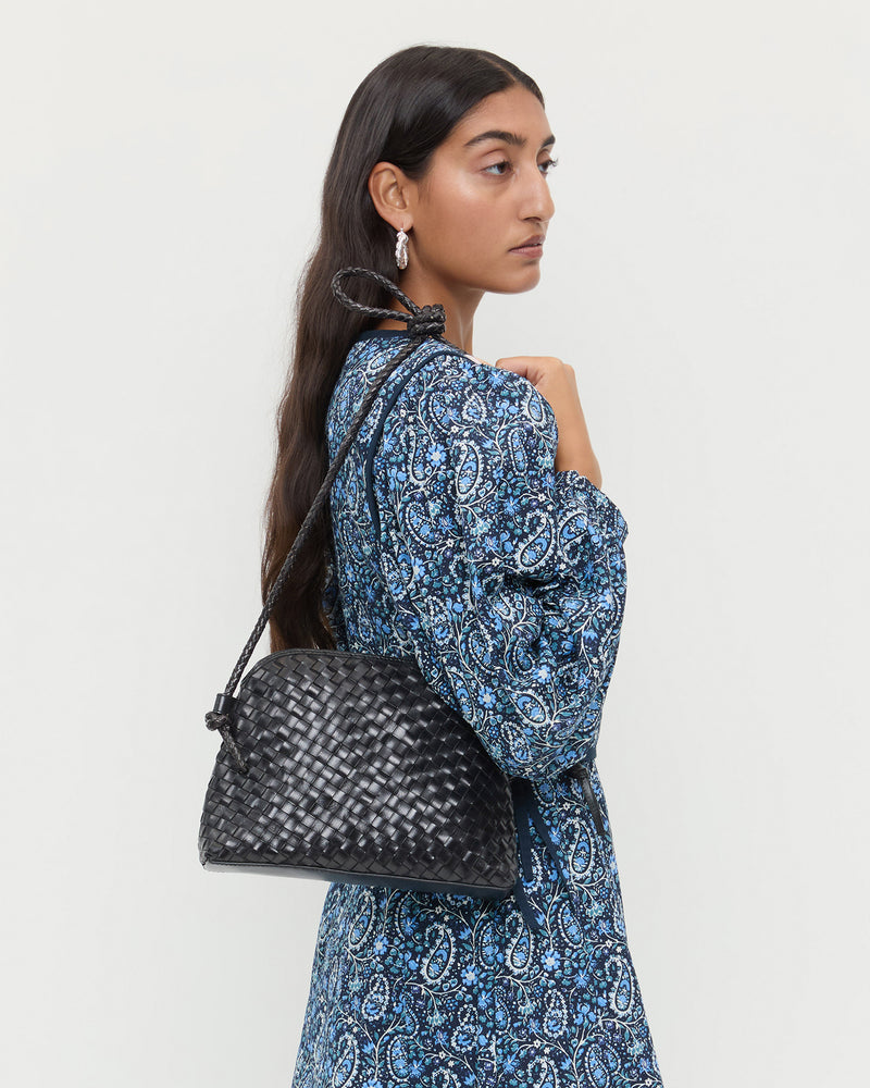 Mallory Black Woven Leather Crossbody in black woven leather and Ainsley Dress in blue floral.