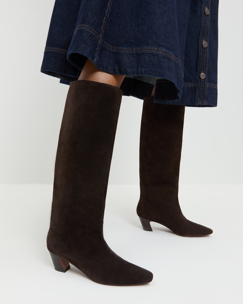 Marley Brown Suede Tall Boot in brown suede and Ruthie Denim Skirt in dark blue.