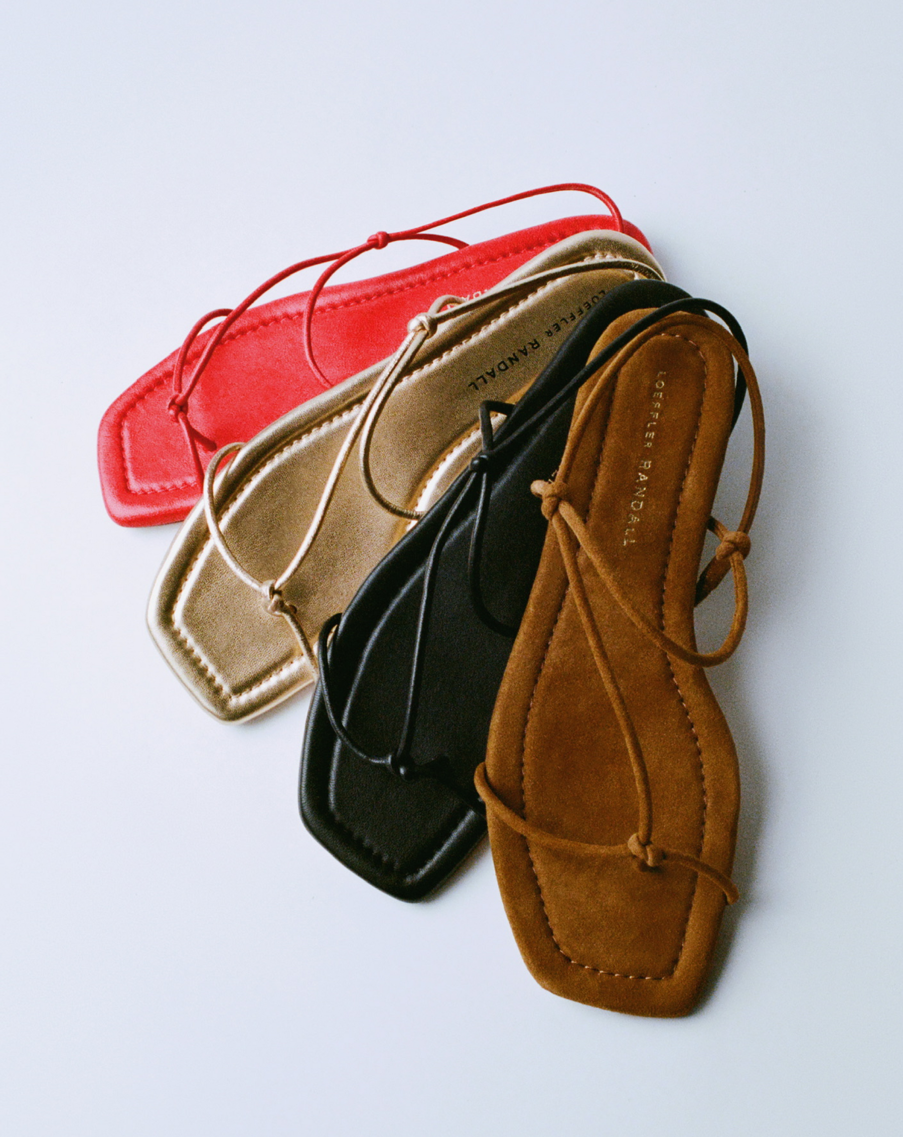 Eleanor Gold Leather Strappy Sandal, Eleanor Cacao Suede Strappy Sandal, Eleanor Black Leather Strappy Sandal, and Eleanor Red Leather Strappy Sandal