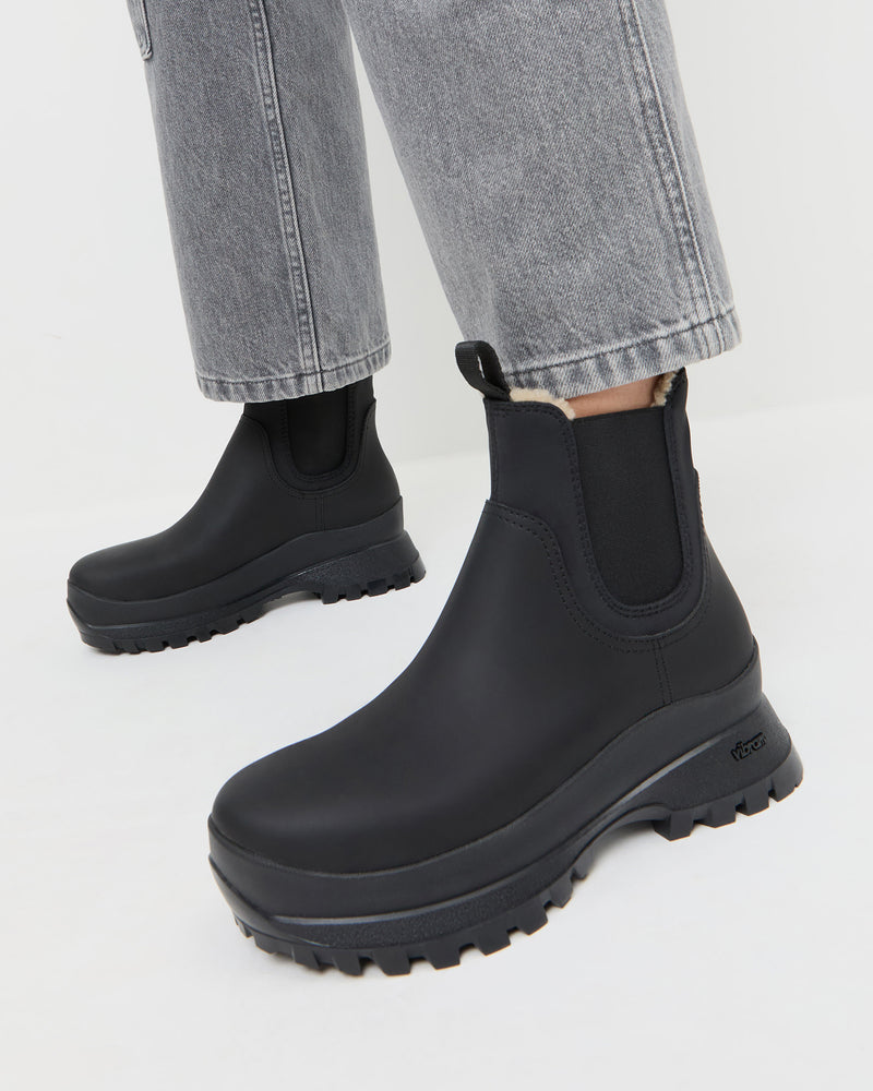 Tara Black Shearling-Lined Boot in black leather and Molly Workwear Jean in grey denim.