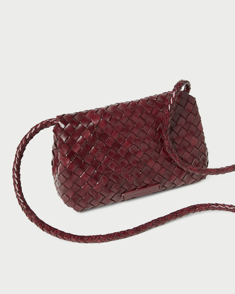 Vinnie Maroon Woven Leather Crossbody in maroon woven leather.