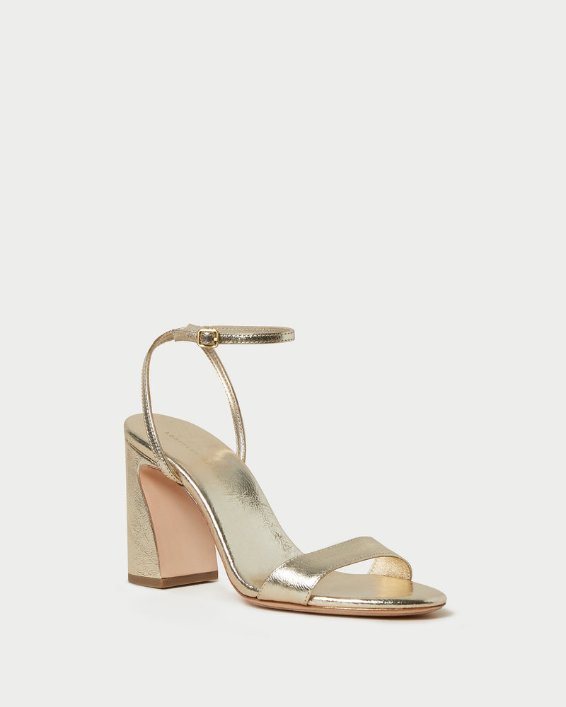 Malia Champagne Curved-Heel Sandal in metallic champagne leather
