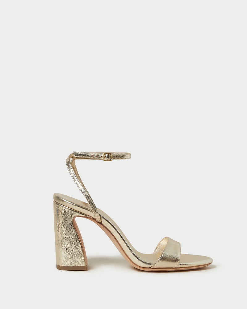 Malia Champagne Curved-Heel Sandal in metallic champagne leather