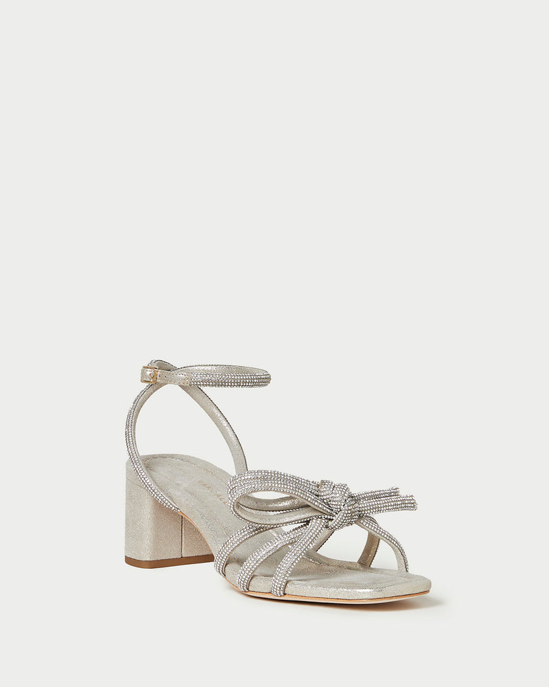 Mikel Cappuccino Bow Mid-Heel Sandal in light champagne sparkle suede