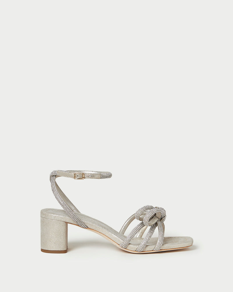 Mikel Cappuccino Bow Mid-Heel Sandal in light champagne sparkle suede
