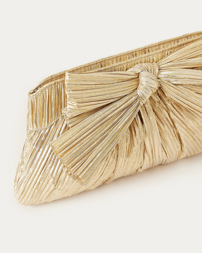 Rayne Gold Bow Clutch in gold pleated lamé