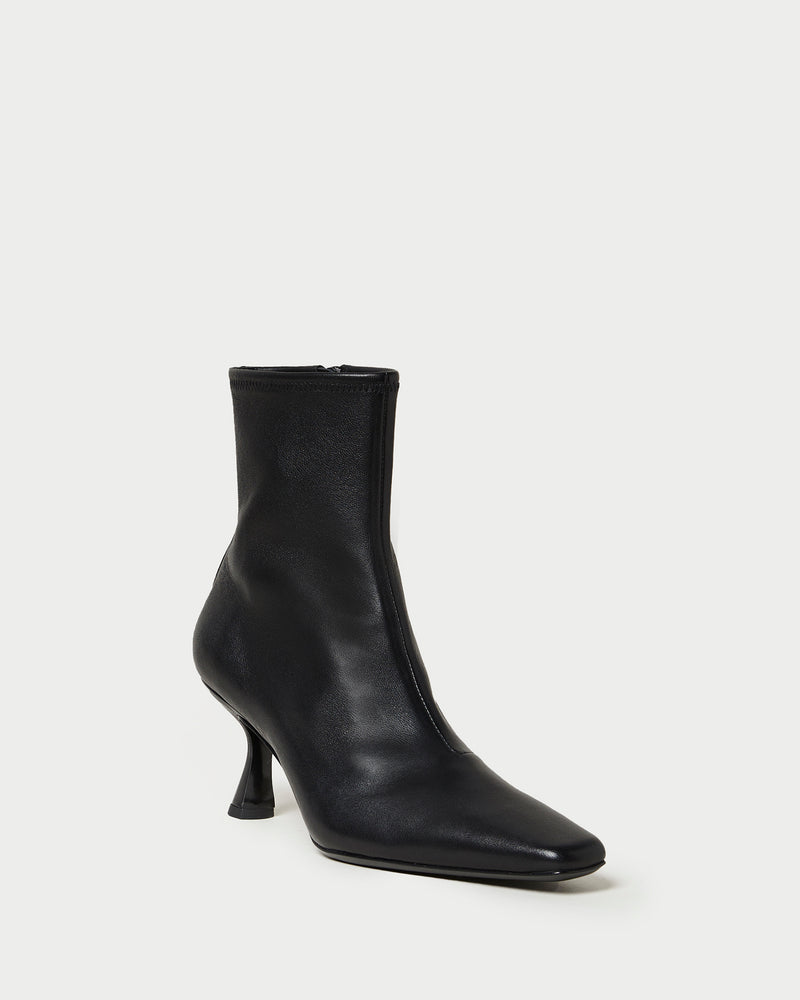Thandy Black Leather Curved Heel Bootie in black leather.