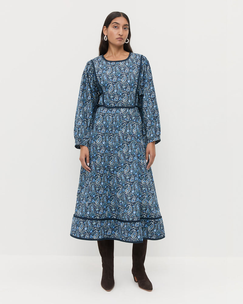 Ainsley Dress in quilted cotton with a blue paisley floral design and Marley Brown Suede Tall Boots.