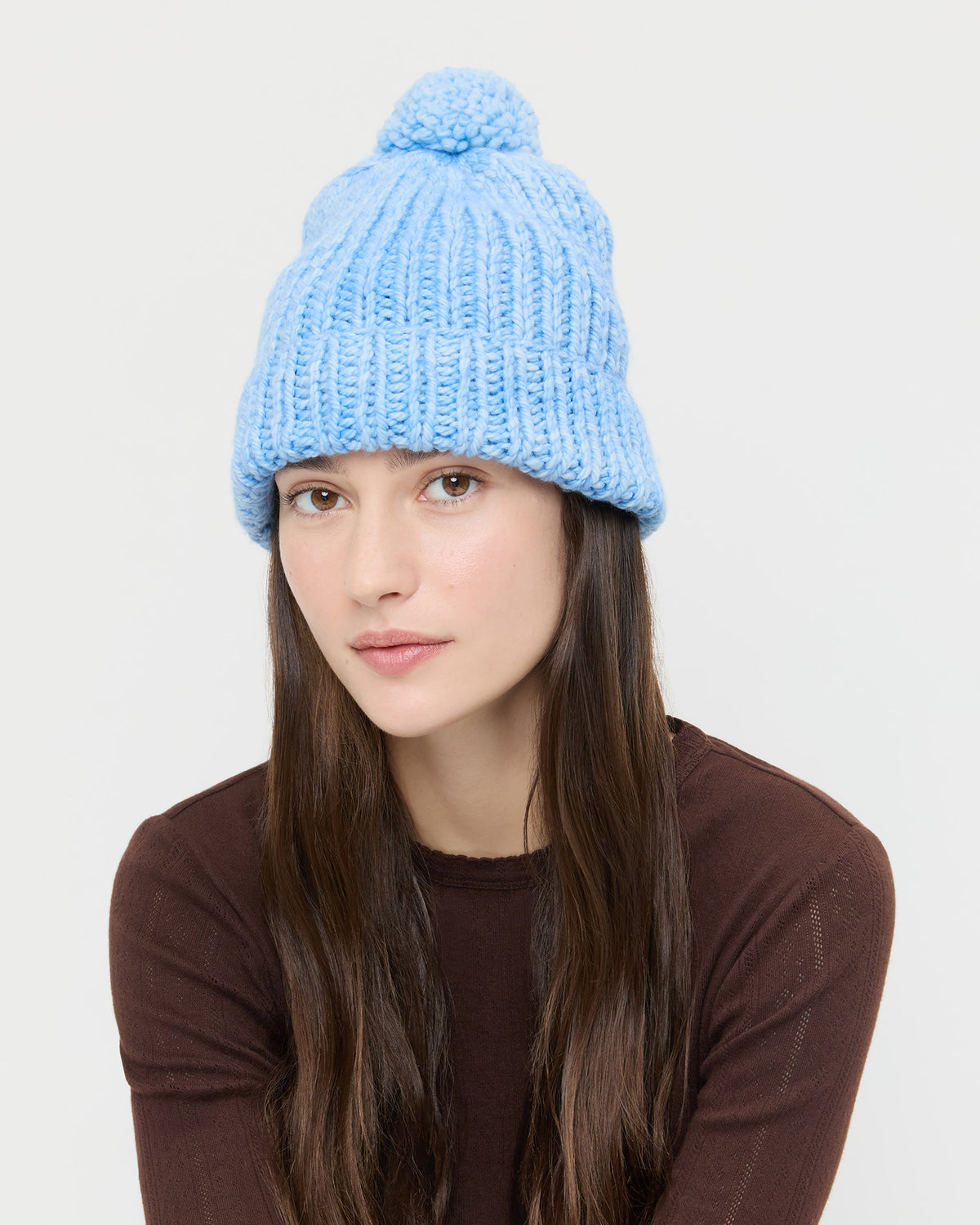 April Light Blue Pompom Hat in light blue knit wool.