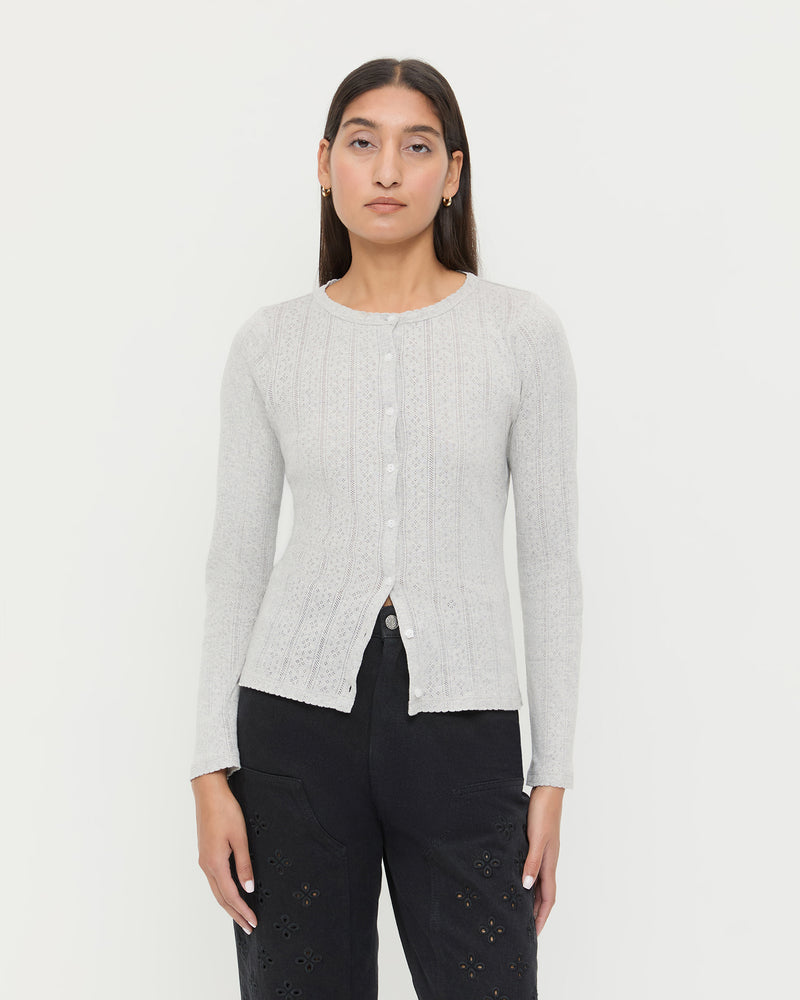 Ash Pointelle Cardigan, long-sleeve cardigan in heather grey pointelle cotton and Demi Embroidered Pant in black denim.