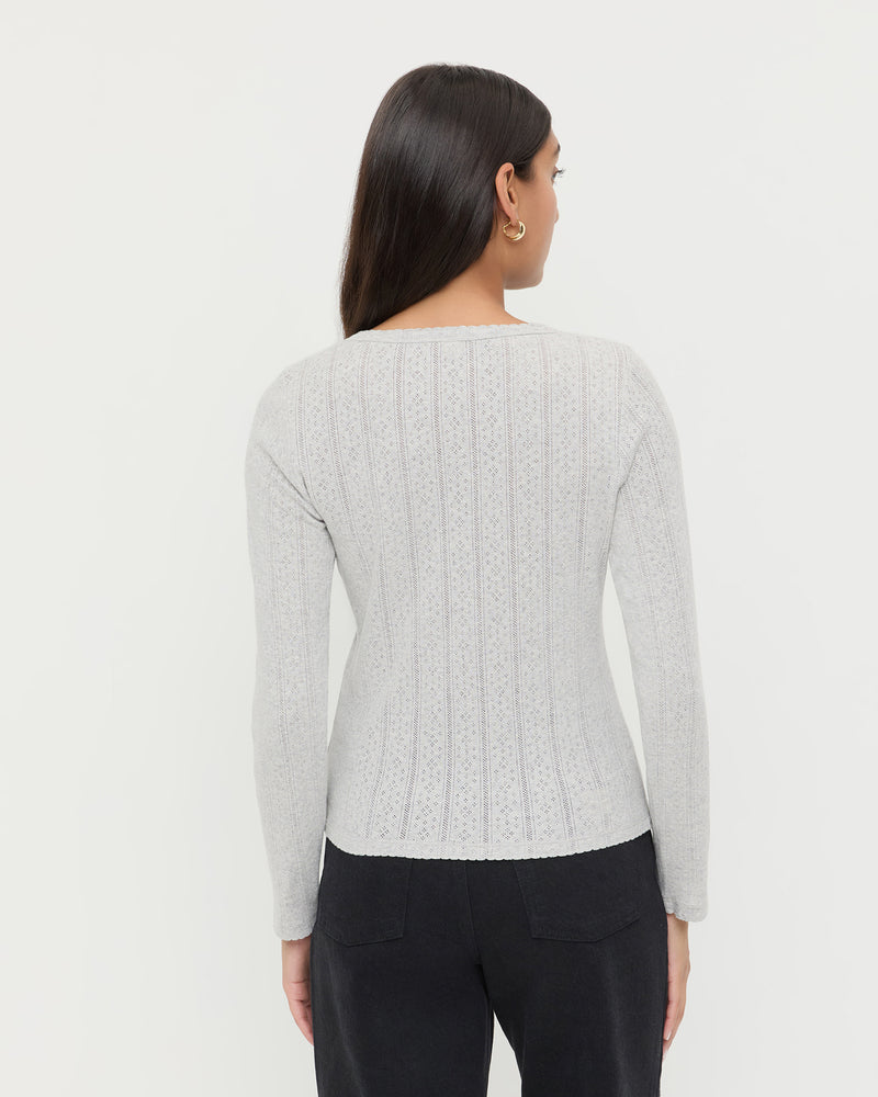 Ash Pointelle Cardigan, long-sleeve cardigan in heather grey pointelle cotton and Demi Embroidered Pant in black denim.