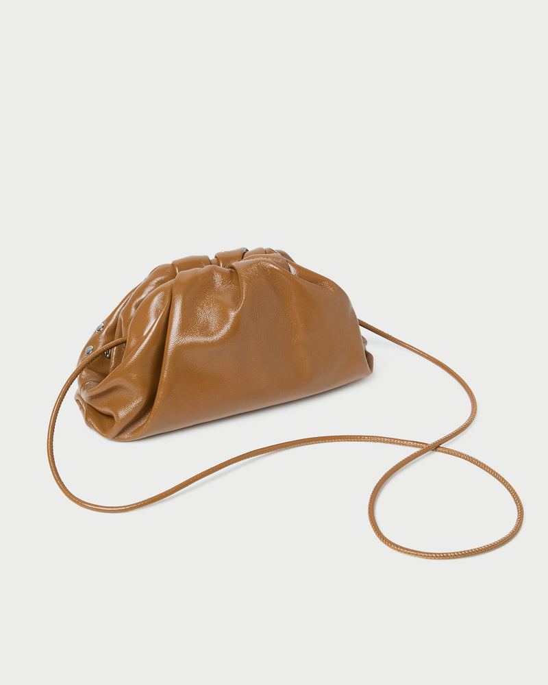 Bailey Safari/Silver Leather Dome Clutch in a safari tan leather with silver studs.