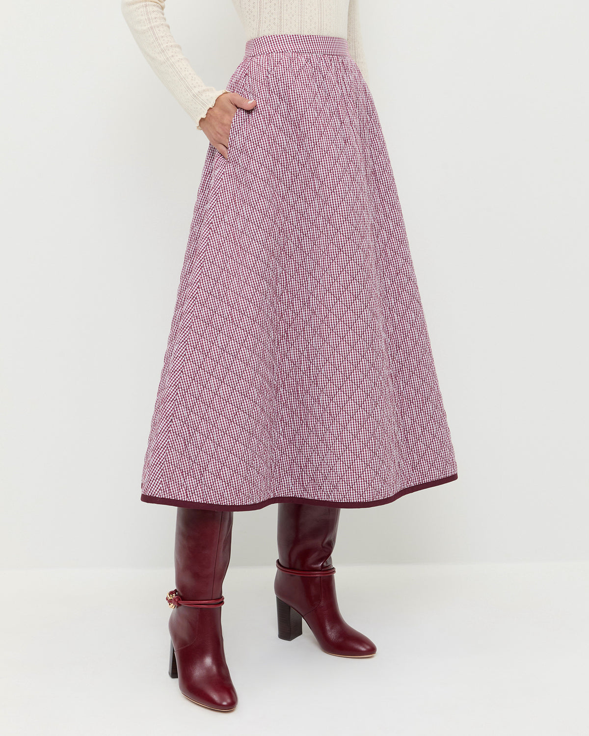 Clara Quilted Skirt in quilted cotton in maroon gingham and Goldy Wine/Gold Leather Tall Boots.