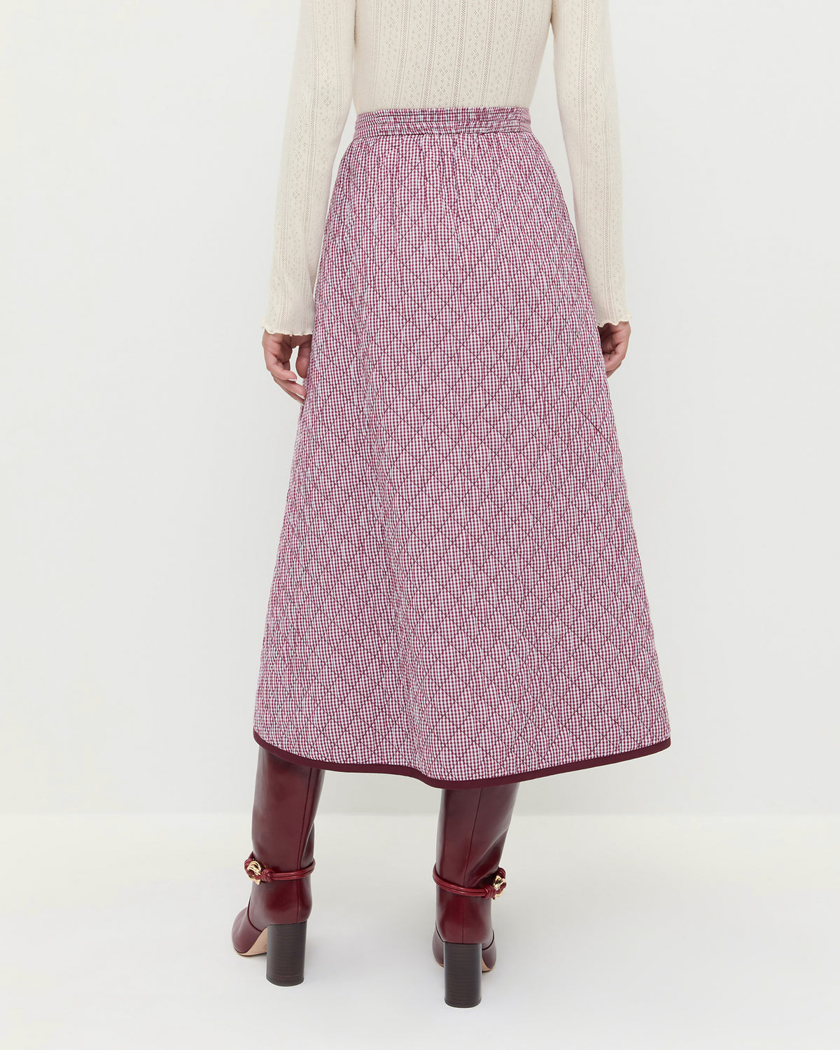 Clara Quilted Skirt in quilted cotton in maroon gingham and Goldy Wine/Gold Leather Tall Boots.