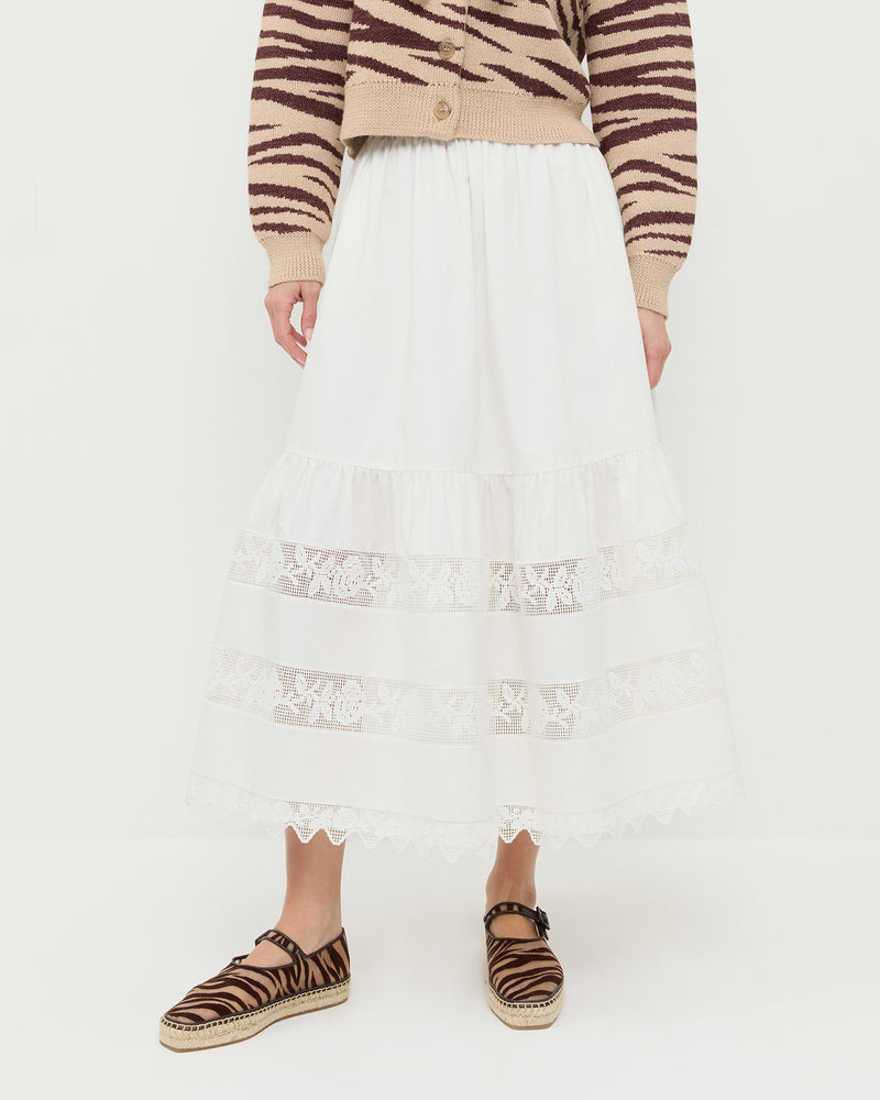 Delaney Midi skirt in cream cotton with lace detailing, Bodhi Cardigan in zebra wool, and Clover Zebra Mesh Espadrille.