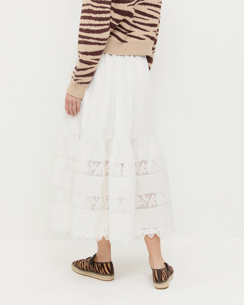 Delaney Midi skirt in cream cotton with lace detailing, Bodhi Cardigan in zebra wool, and Clover Zebra Mesh Espadrille.