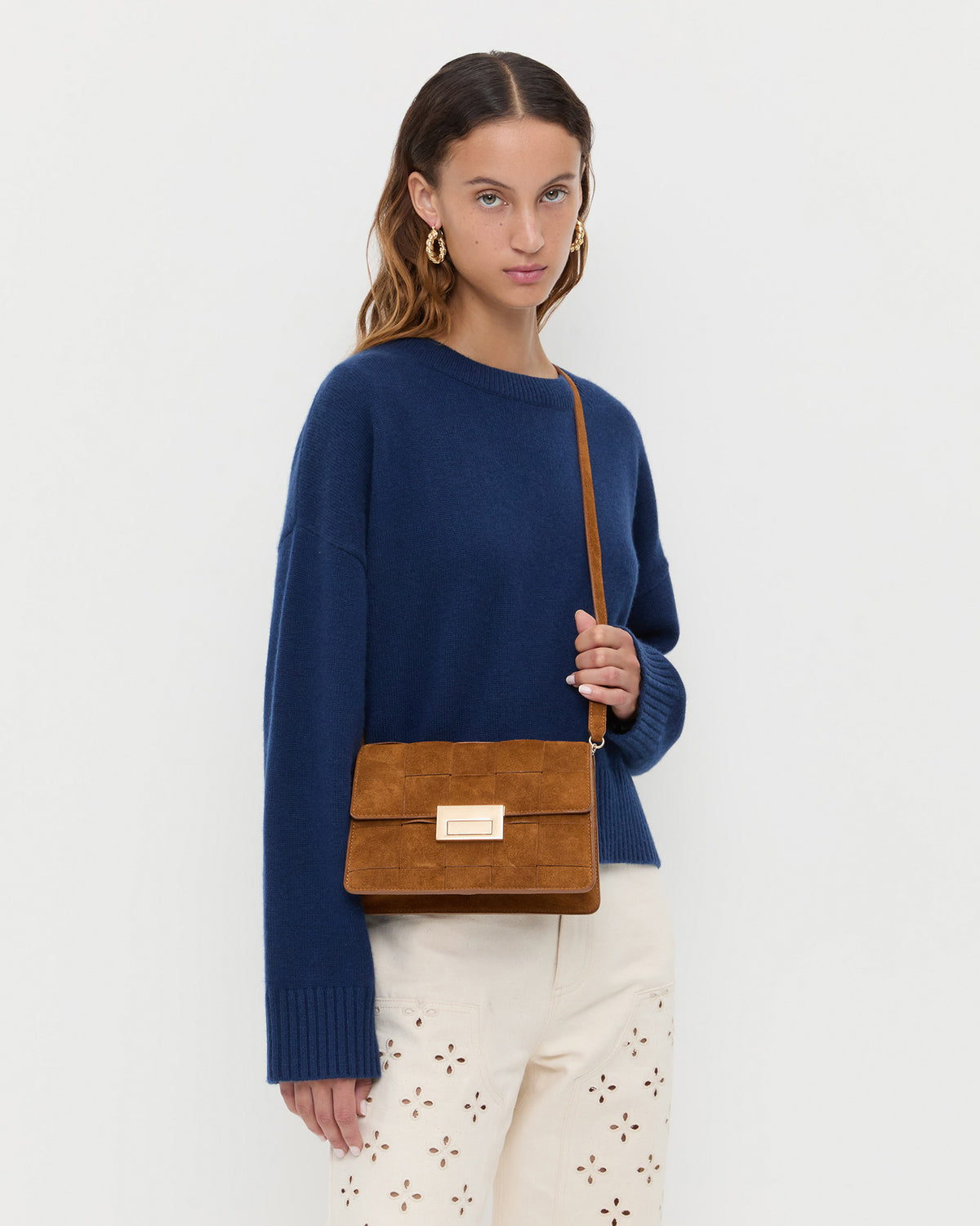 Delphine Cacao Suede Shoulder Bag, Lana Cashmere Sweater in navy, and Demi Embroidered Pant in natural.