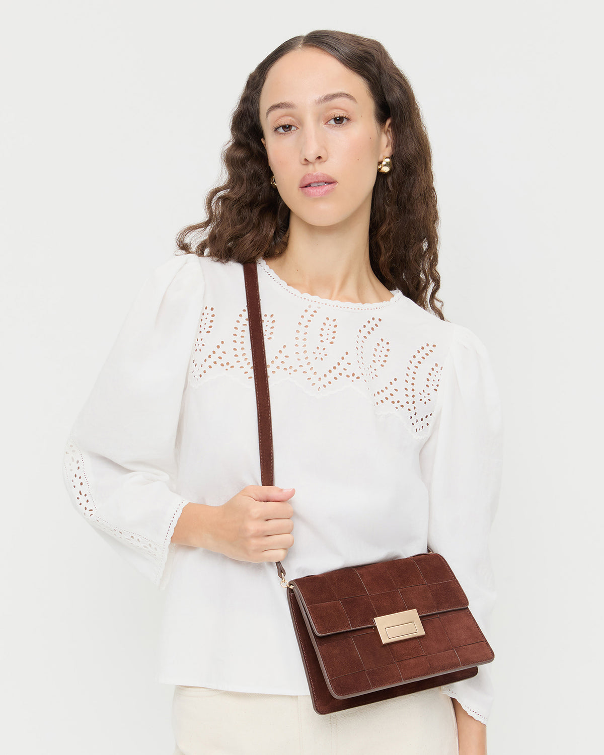 Delphine Espresso Suede Shoulder Bag in espresso brown woven suede and Felicity Blouse in white cotton.