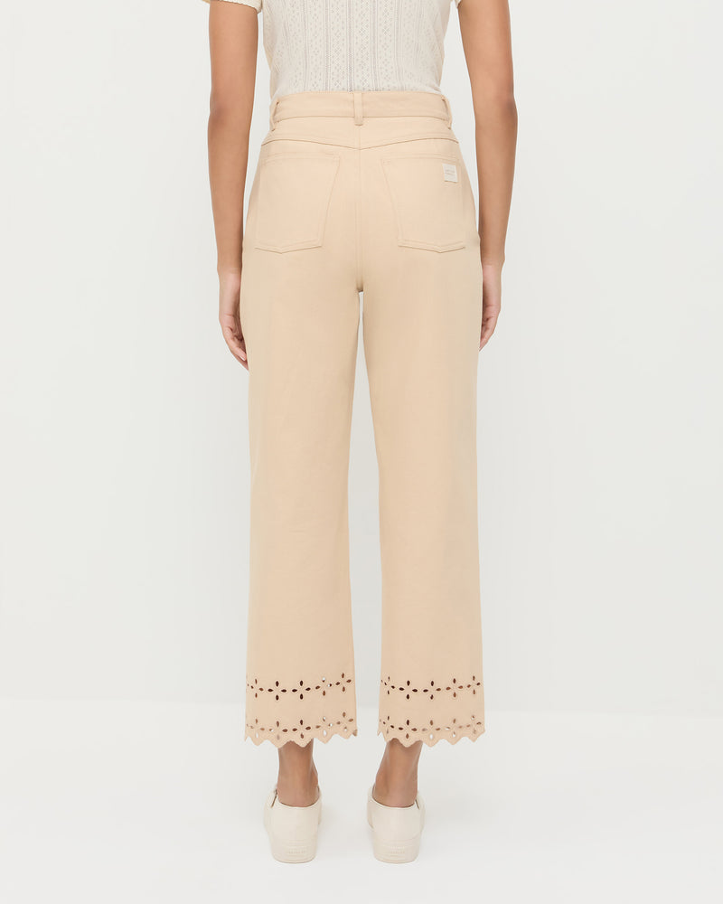 Demi Embroidered Pant in tan Japanese cotton twill with eyelet lace, Kerri Pointelle Tee in white cotton, and Cooper Natural Mary Jane Sneaker.