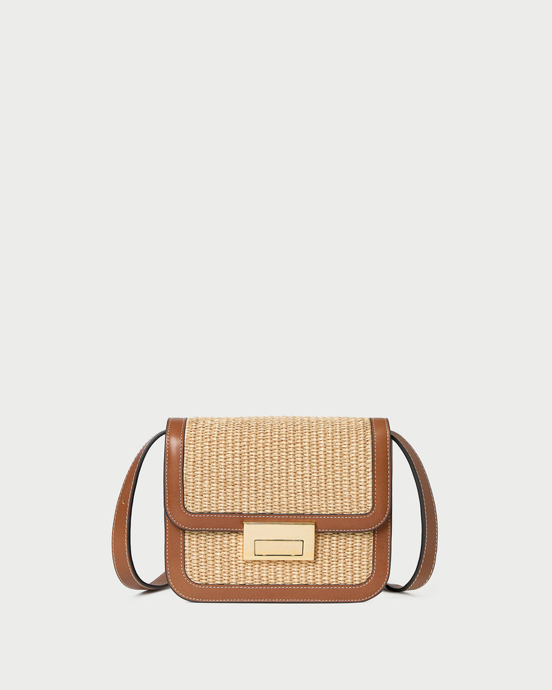 Desi Natural/Cacao Straw Crossbody in natural straw with cacao brown leather trim.