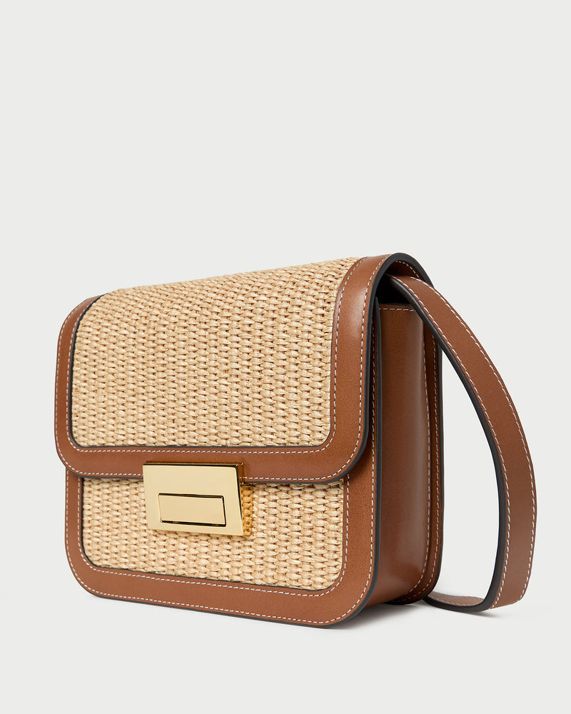 Desi Natural/Cacao Straw Crossbody in natural straw with cacao brown leather trim.