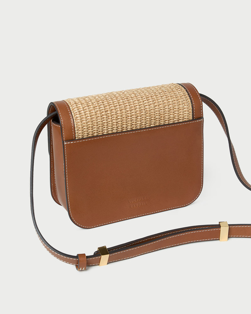 Desi Natural/Cacao Straw Crossbody in natural straw with cacao brown leather trim.