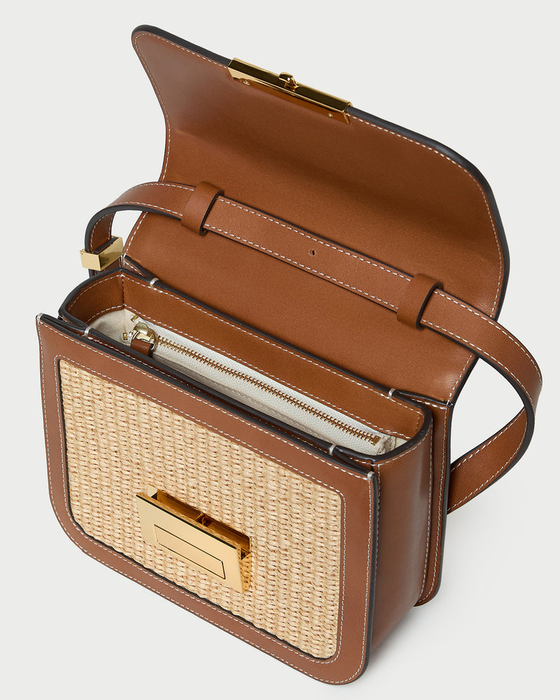 Desi Natural/Cacao Straw Crossbody in natural straw with cacao brown leather trim.