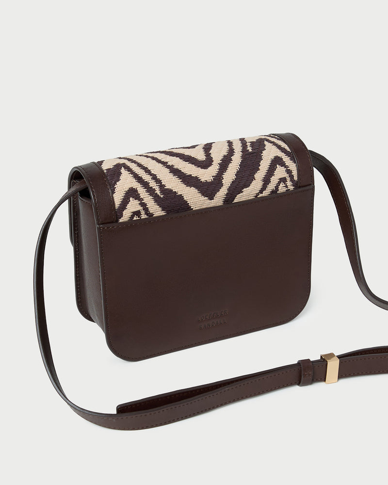 Desi Zebra Straw Crossbody in zebra woven cotton fabric with dark brown leather.