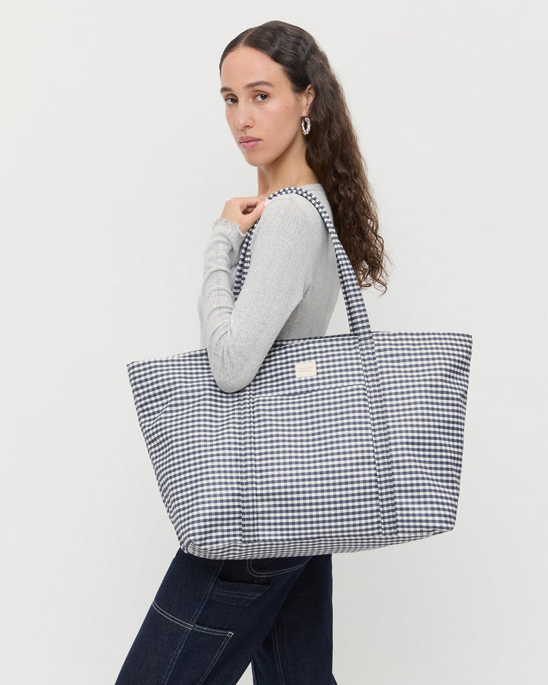 Dina Black/White Gingham Travel, Lolo Pointelle Long Sleeve in grey, and Molly Workwear Jean in dark blue denim.