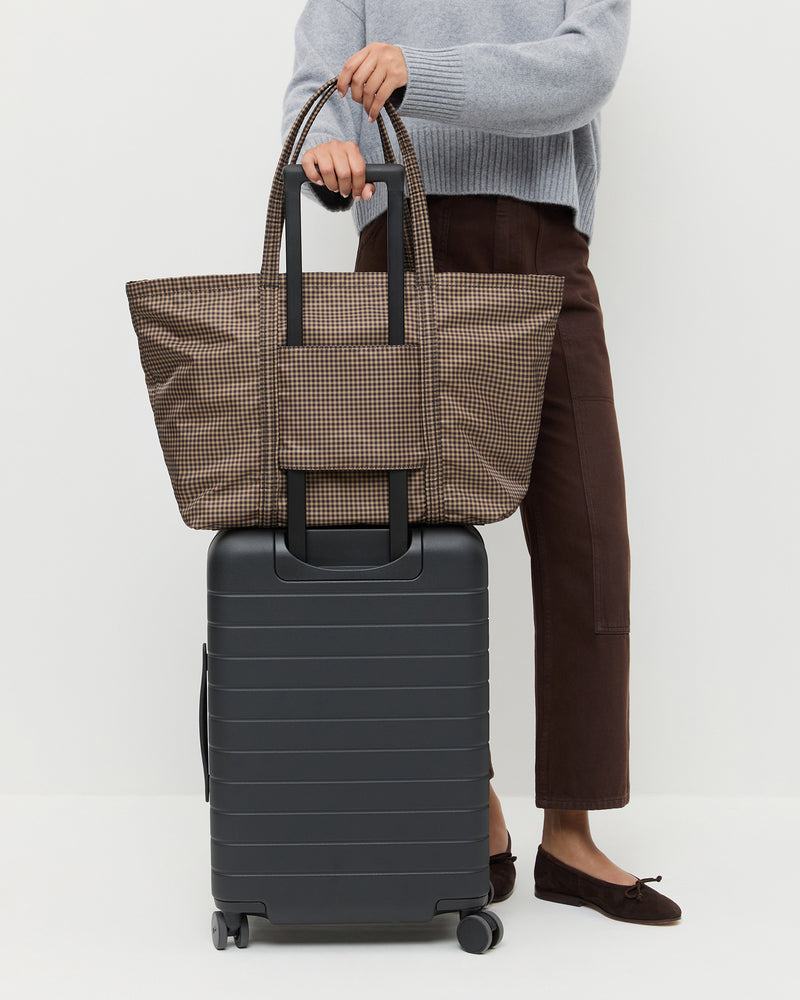 Dina Brown/Black Check Travel Tote in brown and black check nylon, Lana Cashmere Sweater in grey cashmere, and Molly Workweark Jean in brown denim.