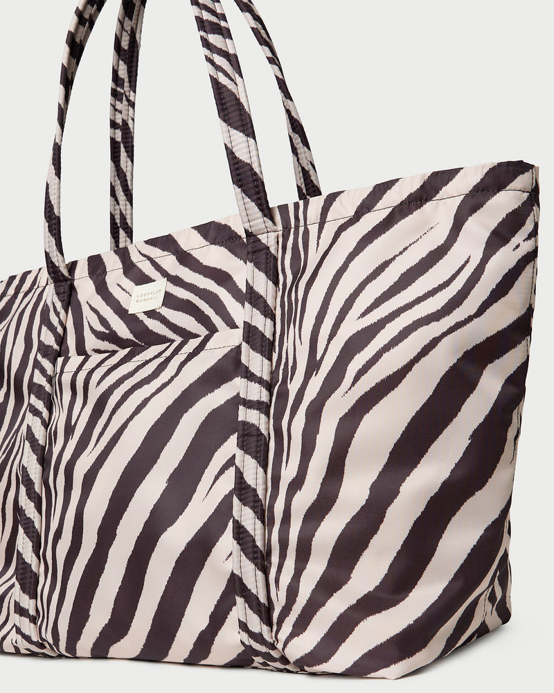 Dina Zebra Travel Tote in zebra print nylon.
