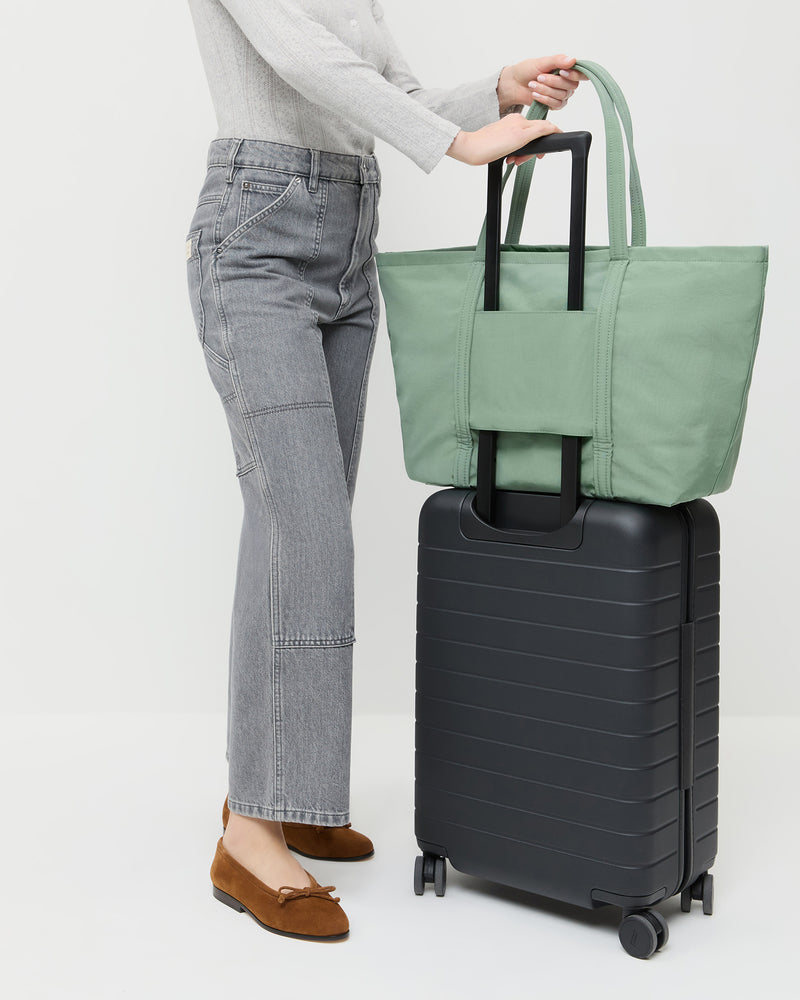 Dina Sage Travel Tote in sage green nylon, Lolo Pointelle Long-Sleeve Top in grey cotton, Molly Workwear Jean in grey denim, Noelle Cacao Suede Ballet Flat.