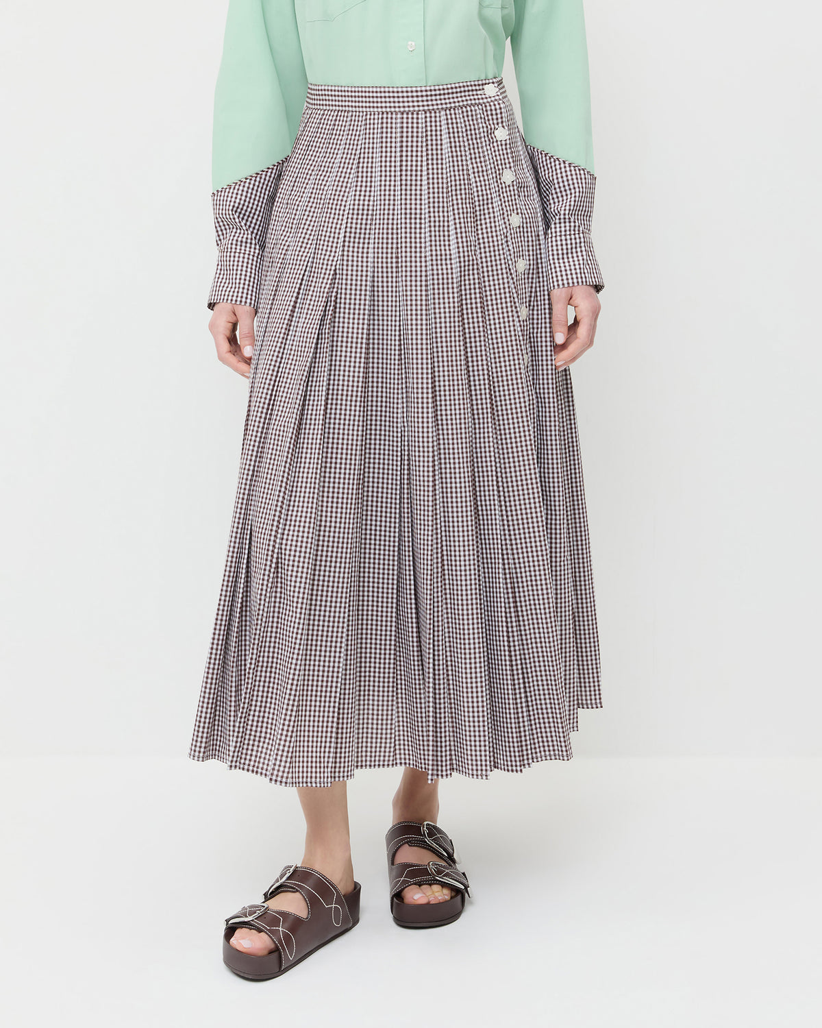 Emlyn Midi Skirt in brown gingham cotton, Casey Shirt in mint green and brown gingham cotton, and Nico Espresso Two-Band Sandal.
