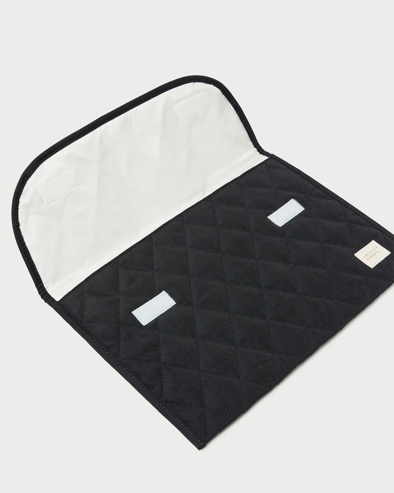 Faris Black Laptop Sleeve in quilted black nylon.