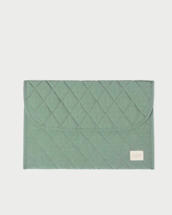 Faris Sage Laptop Sleeve in quilted sage green nylon.