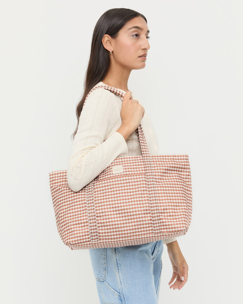 Mira Brown Gingham Everyday Tote Bag in water-resistant nylon, Lolo Pointelle Long-Sleeve Top in cream cotton, Molly Workwear Jean in light blue denim.
