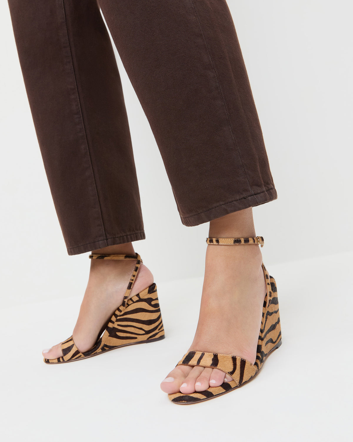 Gavi Wedge sandal in tan zebra print hair calf and Winona Denim Pant in dark brown denim.
