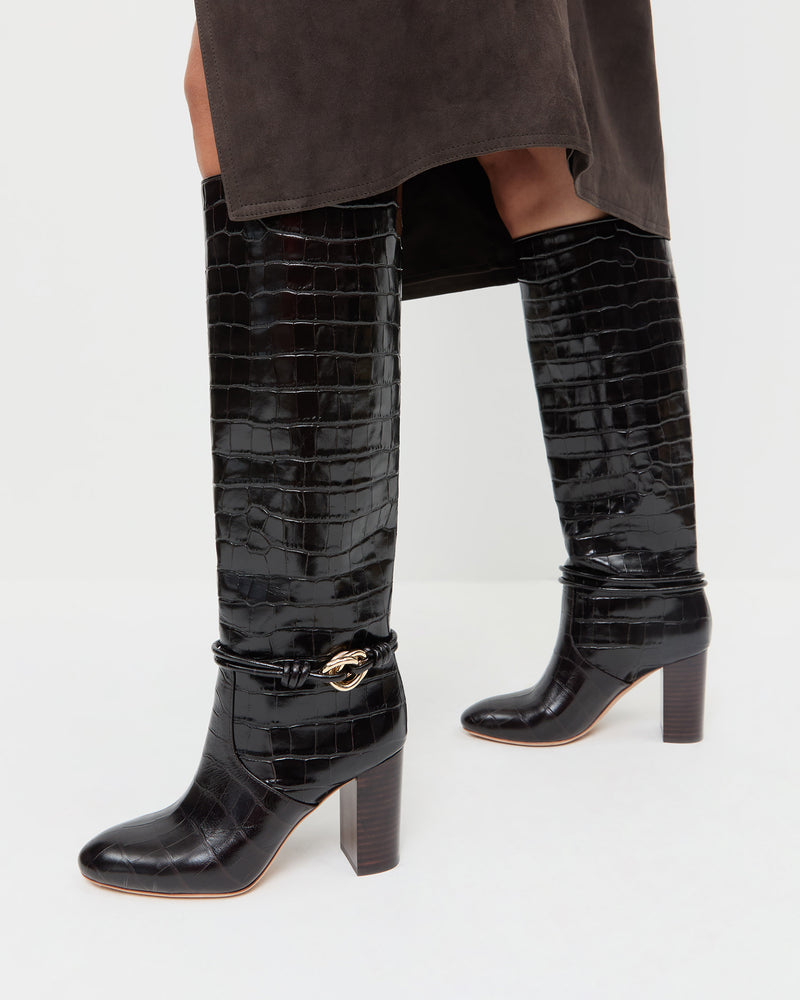 Goldy Crocodile/Gold Leather Tall Boot in crocodile print leather with gold accent and Tansy Suede Skirt in brown suede.