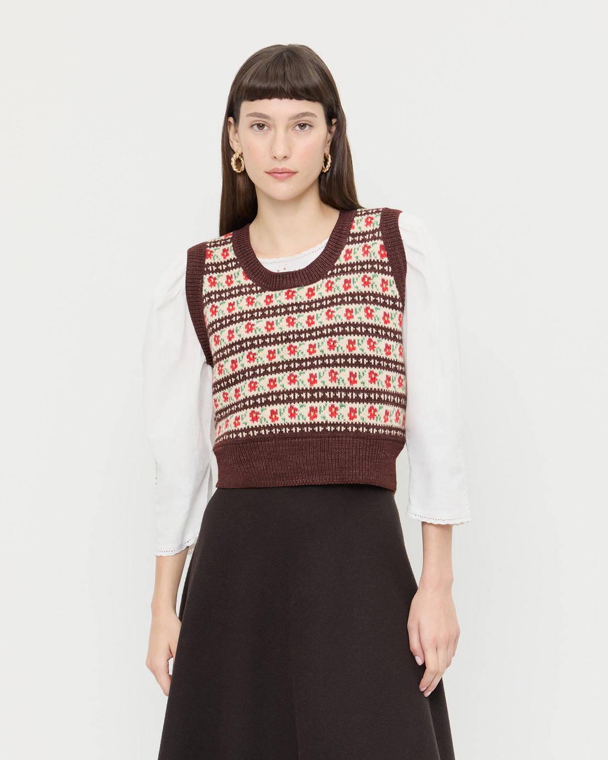 Heather Sweater Vest in brown and red intarsia floral, Felicity Blouse in cream cotton, and Tansy Suede Skirt in brown suede.