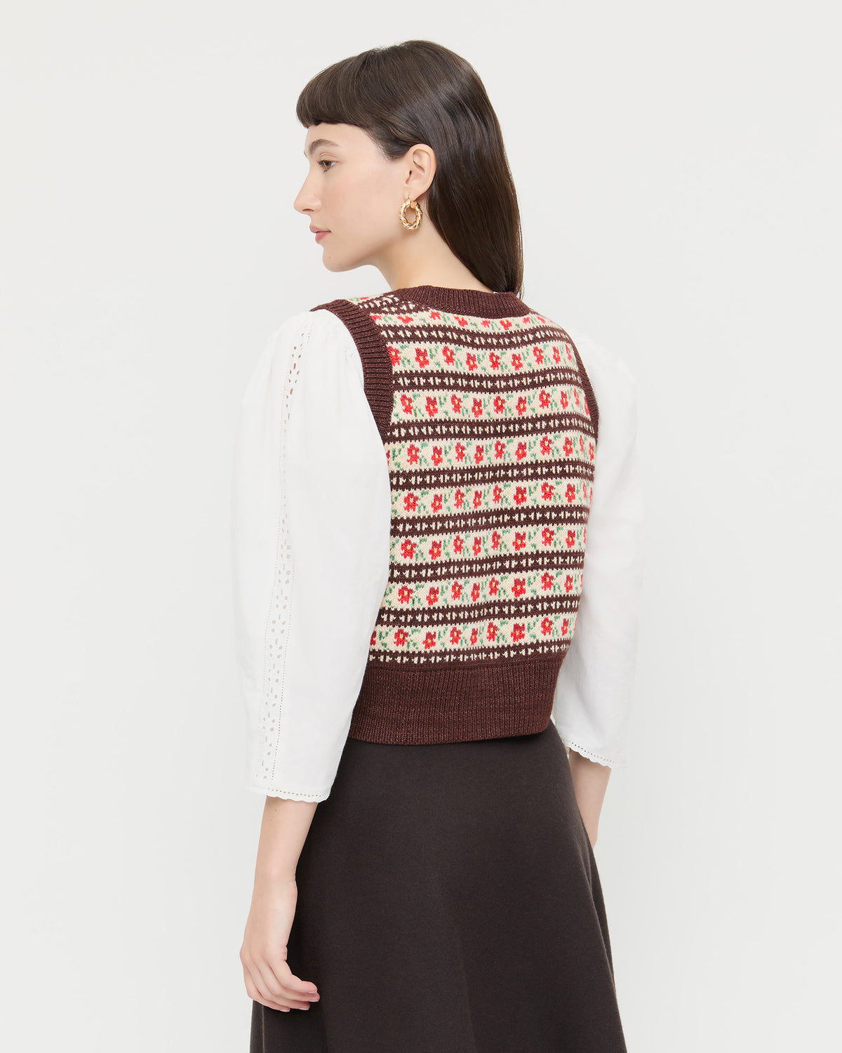 Heather Sweater Vest in brown and red intarsia floral, Felicity Blouse in cream cotton, and Tansy Suede Skirt in brown suede.