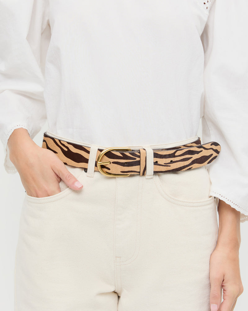 Isaac Zebra Belt in zebra calf hair, Felicity Blouse in white cotton, and Winona Denim Pant in natural denim.