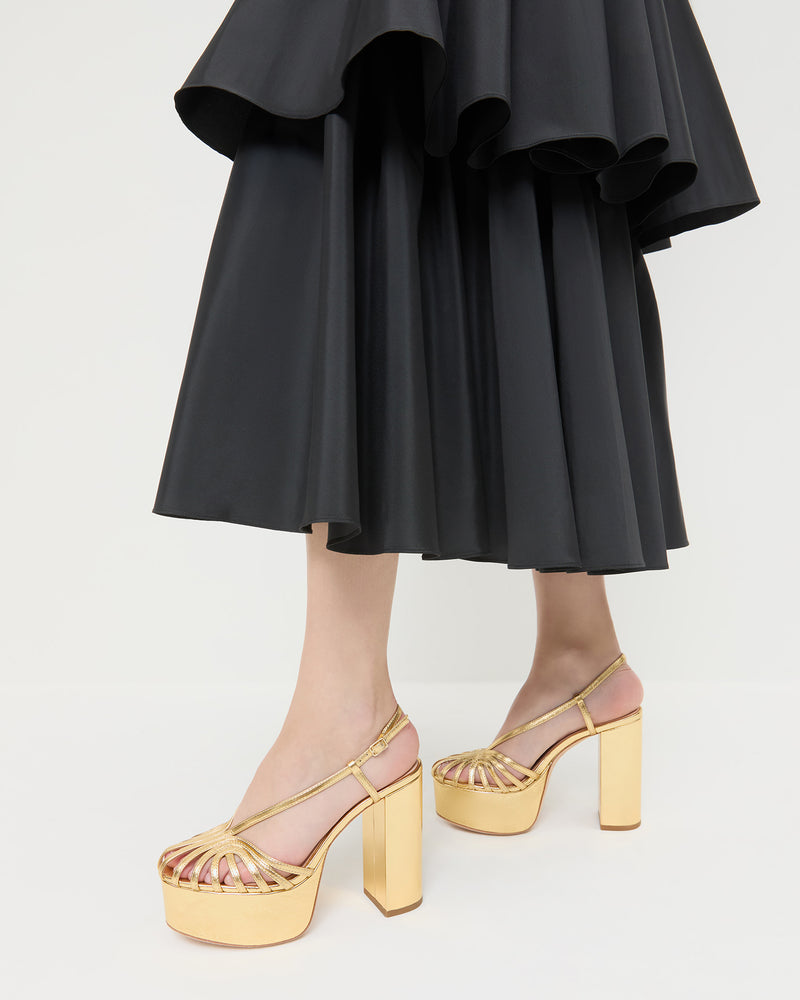 Isabella Gold Leather Platform Sandal in gold leather in Sora Skirt in black taffeta.