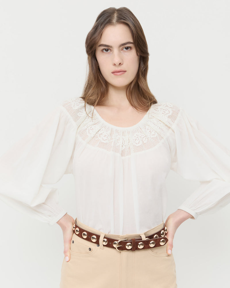 Issa Espresso/Champagne Studded Belt in espresso leather with champagne accent studs, Hattie Top in white cotton, and Demi Embroidered Pant in tan cotton.