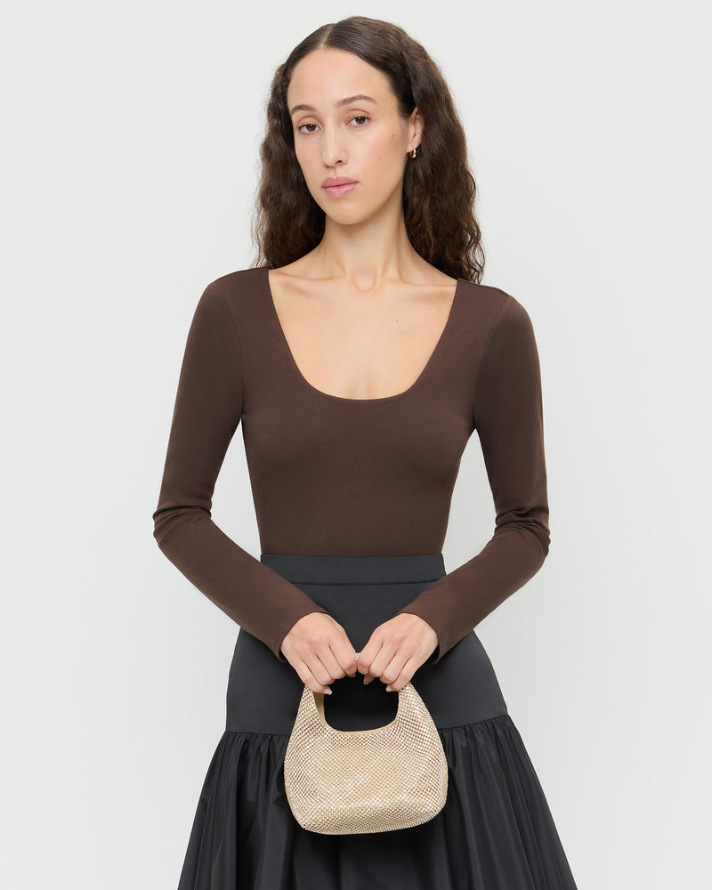 Kenzie Gold Diamanté Mini Bag in gold diamante mesh, Lumi Long-Sleeve Bodysuit in chocolate jersey, and Sora Skirt in black taffeta.