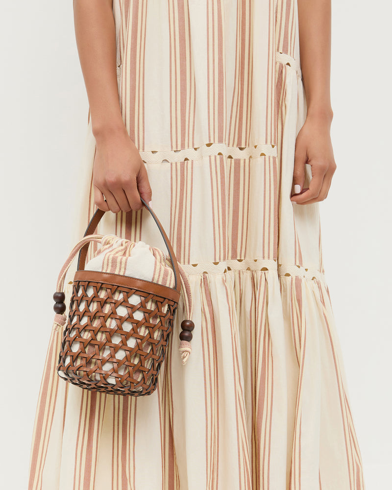 Laith Timber/Butter Bucket Bag with yellow and brown striped canvas and timber brown leather and Alison Camisole Dress in yellow and brown striped cotton.